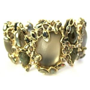 Alexis Bittar mocha color lucite bracelet w/crystals in gold tone framing.